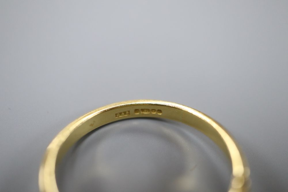 A modern 18ct gold, synthetic sapphire? and diamond circular cluster ring, size P, gross 4.7 grams.